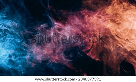 Color smoke. Mist cloud. Spiritual energy. Neon pink blue orange light steam flow on dark black copy space abstract background.