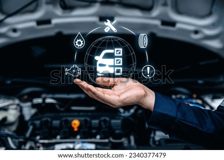 Hand of mechanic holding car service and checking, Customer service guarantee concept Royalty-Free Stock Photo #2340377479