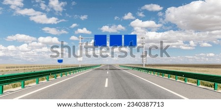 Blue blank signboard on expressway in western China
 Royalty-Free Stock Photo #2340387713