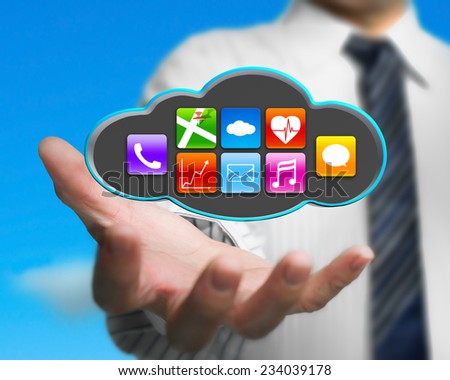 businessman holding colorful app icons on black cloud with nature blue sky background