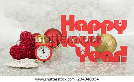 Christmas present and red clock on a snowy background