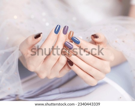 Beautiful colored nail polishes with shine and reflections,Fashionable spring summer nail design,large aperture blurred background