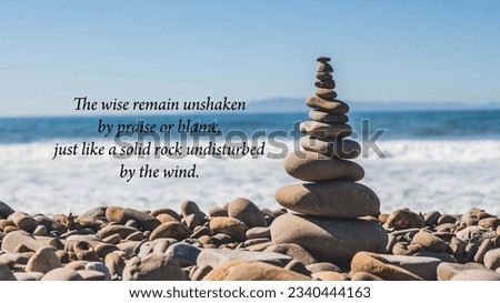 Buddhist quotes - The wise remain unshaken by praise or blame, just like a solid rock undisturbed by the wind. Royalty-Free Stock Photo #2340444163