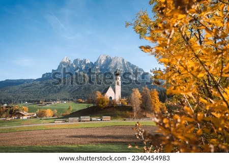 Bright photo of St. Constantine church in Dolomites, Trentino Alto Adige Italy Royalty-Free Stock Photo #2340454983