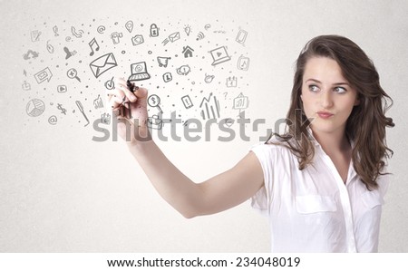 Young woman drawing and sketching icons and symbols on white background