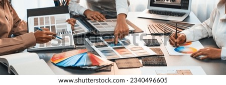 Group of interior designer team in meeting, discussing with engineer on interior design and planning for house project blueprint and model, choosing various mood board materials. Insight Royalty-Free Stock Photo #2340496605