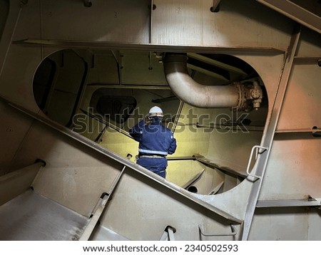 Inspection top side tank for ballast water on vessel Royalty-Free Stock Photo #2340502593
