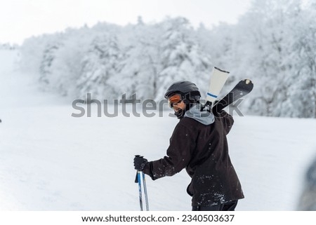 Portrait of Asian man athlete practice skiing on snow mountain at ski resort. Handsome guy enjoy and fun outdoor active lifestyle travel nature and winter extreme sport training on holiday vacation.