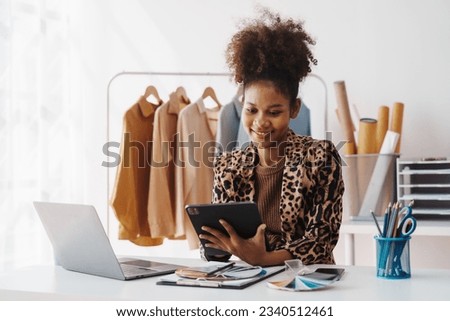 Sell Clothes Online With Print-On-Demand, pretty african american clothing designer selling online start a sustainable fashion brand High-quality print on demand clothing. Fast shipping worldwide. Royalty-Free Stock Photo #2340512461