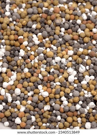 Granular chemical fertilizer for gardening Royalty-Free Stock Photo #2340513849