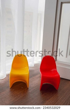 Indoor photography - Small chair mockup in front of white curtains.