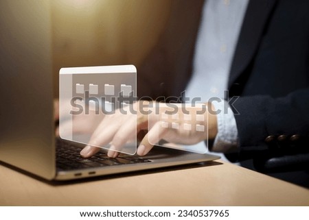 Businessman using computer for Document Management System (DMS) and online documentation database, paperless office concept