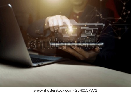 Businessman using computer for Document Management System (DMS) and online documentation database, paperless office concept