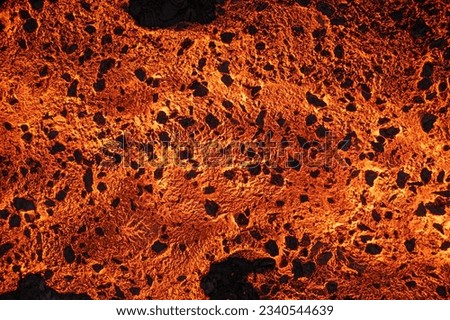 Aerial view of spreading melted lava from volcano. Beautiful natural forces creating abstract background. Litli Hrutur, Fagradalsfjall, Iceland July, 2023. Royalty-Free Stock Photo #2340544639