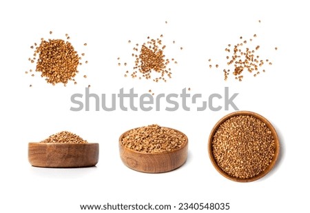 Raw Buckwheat Pile in Wood Bowl Isolated, Dry Buck Wheat Grains, Russian Kasha Heap, Uncooked Buckwheat Cut Out on White Background Side View Royalty-Free Stock Photo #2340548035