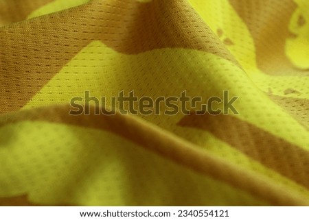 Texture, background, pattern. Patterned yellow fabric texture.