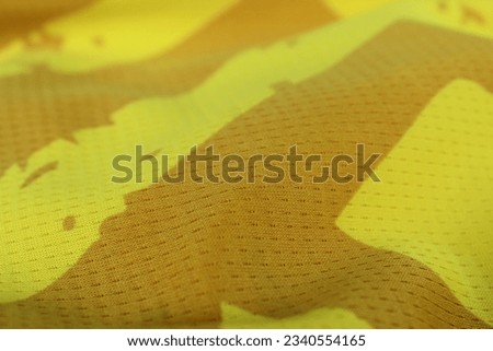 Texture, background, pattern. Patterned yellow fabric texture.