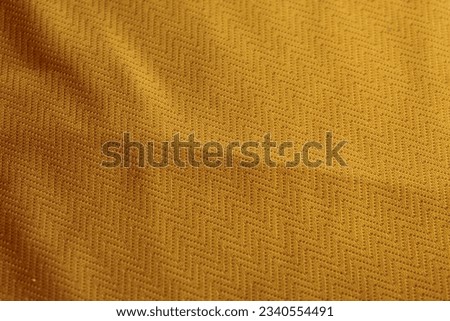 Texture, background, pattern. Orange colored fabric texture.