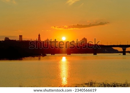 Silhouette of Kyiv at sunset. Summer cityscape in Ukraine.