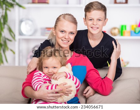 Young mother and her two children. Happy family.