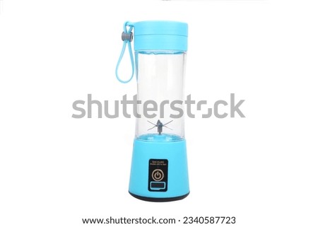 USB rechargeable electric mini portable handheld smoothie blender and juice cup bottle mixer. electric blue color handheld juice blender and juice cup. Royalty-Free Stock Photo #2340587723