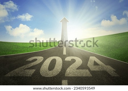 A road turning into an arrow rising upward symbolizing the direction to success in the year 2024