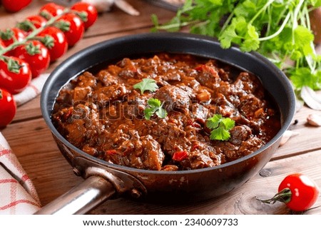 Beef goulash, soup and a stew, made of beef chuck steak plenty of paprika. Hungarian traditional meal. Beef stew - goulash Royalty-Free Stock Photo #2340609733