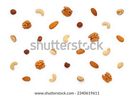 Background from different types of nuts and seeds. Isolated on white background. Flat lay, top view