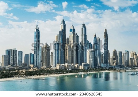 The Palm Jumeirah archipelago opens the view on the coast of the mainland with sand beaches and skyline of Dubai Media City and Dubai Marina with skyscrapers, Dubai, UAE