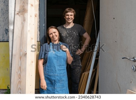 portrait of a couple owners of a small furniture production