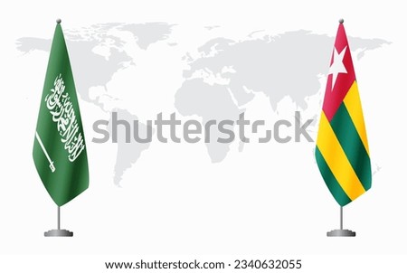 Saudi Arabia and Togo flags for official meeting against background of world map.