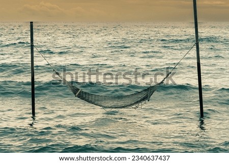 Romantic cozy hammocks in the sea, Peaceful seascape. Relax, travel concept, travelling. Copy space