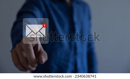Businessman pressing messaging type of modern icons with virtual background. An email not read.
