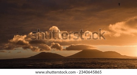 Sunset clouds over Steeple Jason; Sunset clouds, over Steeple Jason; Sunset; Steeple Jason, Falkland Islands