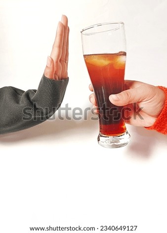 woman showing a gesture of refusing cola, cola drink white background 