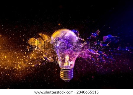 light bulb shattering on black background. concept of creativity and innovation Royalty-Free Stock Photo #2340655315
