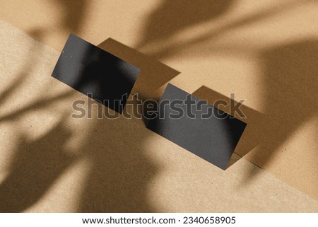Black business cards on cork board table