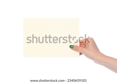 Woman's hand showing white paper banner isolated on white