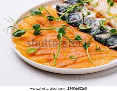 Assorted fish on a plate. smoked and salted fish