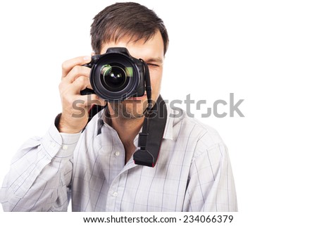 Young man with professional camera isolated on white background
