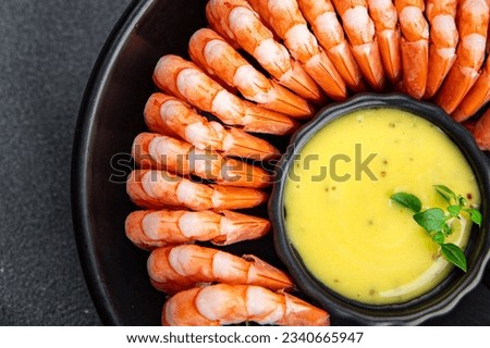 shrimps shelled shrimp ready to eat fresh seafood healthy meal food snack on the table copy space food background rustic top view  pescatarian diet Royalty-Free Stock Photo #2340665947