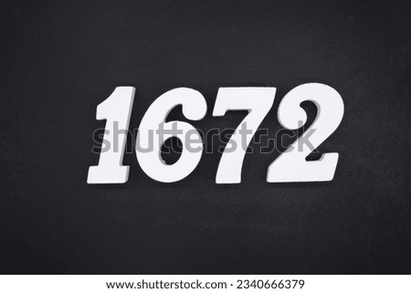 Black for the background. The number 1672 is made of white painted wood.