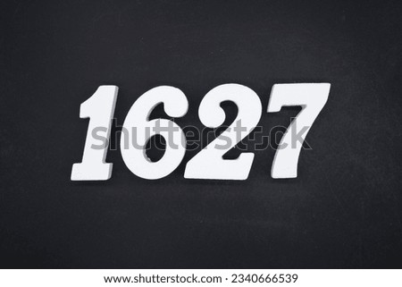 Black for the background. The number 1627 is made of white painted wood.