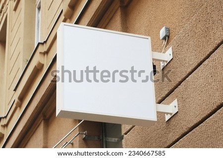 Storefront light box sign, shop, cafe, restaurant mounted signboard mock up design template. Blank white store sign design mockup.