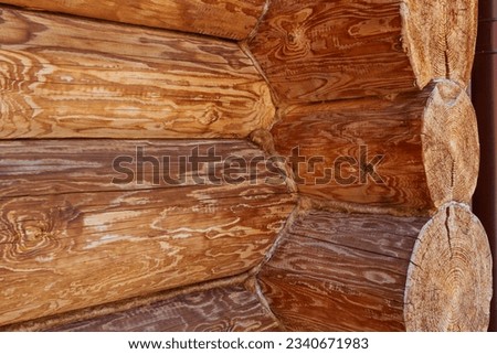 Photo of tree log log house brown. Construction and repair. Village houses.