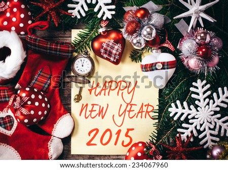 New Year decoration with blank paper on wooden background