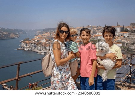 Happy family, visiting Lisbon during summer holiday, people with children, enjoying cityscape in Portugal