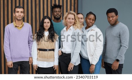 Group of business people standing of a modern office Royalty-Free Stock Photo #2340703119