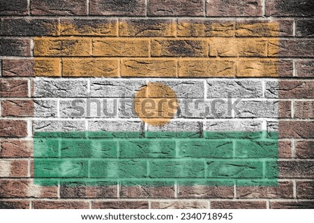 Niger flag on old brick wall background Royalty-Free Stock Photo #2340718945