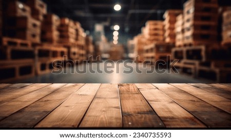 The empty wooden table top with blur background of warehouse storage. Exuberant image. Royalty-Free Stock Photo #2340735593